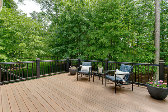 Custom backyard deck surrounded by trees in NW Chicago